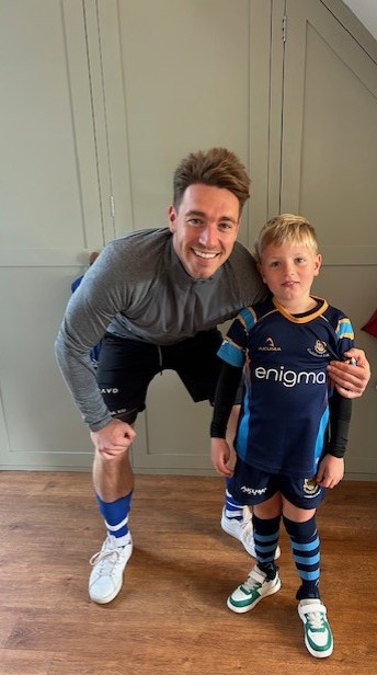 Alex Ryan with his son